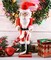 Ornativity Christmas Gift Santa Nutcracker – Red and White Wooden Nutcracker Santa Man in Traditional Santa Attire with a Bag of Gold Wrapped Gifts Over His Shoulder and a List of Names in Hand